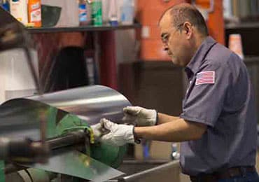 Man repairing HVAC unit