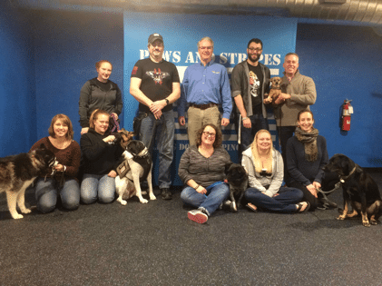 picture of paws and stripes team with dogs