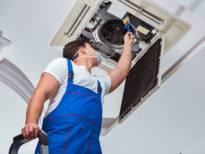 HVAC professional cleaning air duct