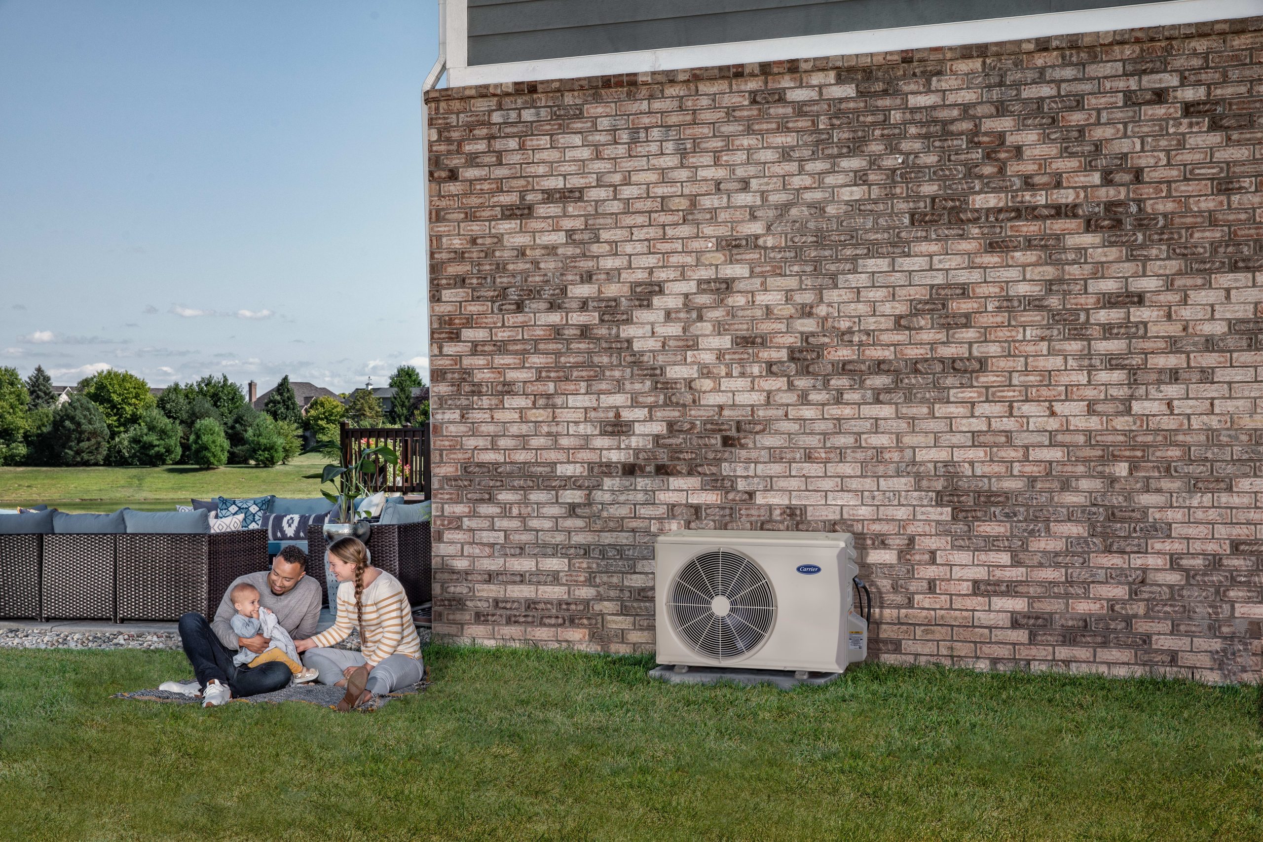 Family_Outside_With_Unit - Anderson Air Corps Legal Action Air Conditioning Inc. Anderson Air Corps Legal Action Air Conditioning Inc. | Heat Pump Installation & Repair