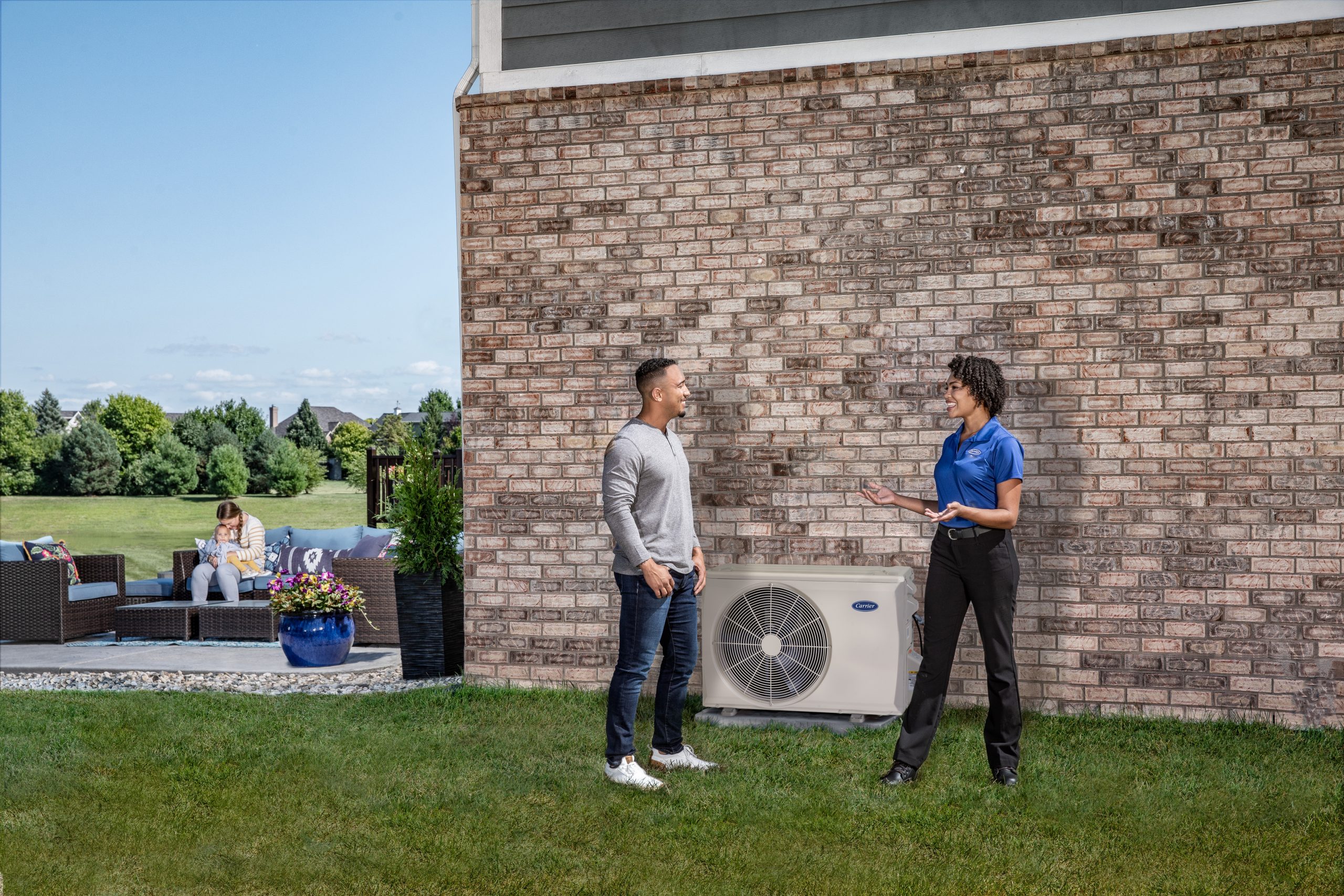 Dealer_With_Homeowner_Outside Anderson Air Corps Legal Action Air Conditioning Inc.|Home